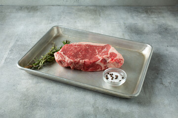 A view of a choice New York steak, on a baking sheet.