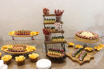Savory buffet table with smoked meats, cheese and french fries