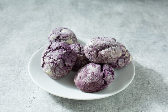 A view of a pile ube crinkle cookies.