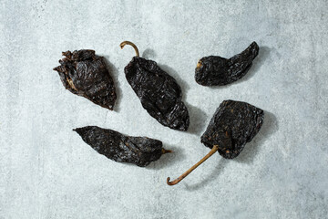 A top down view of some dry chiles mulatos.