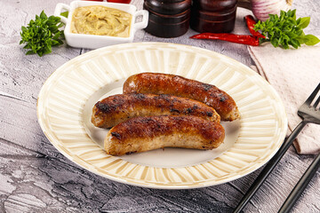 Delicous natural roasted sausages in the plate