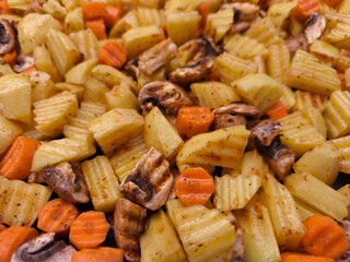 Delicious roasted potatoes, carrots, and mushrooms creating a flavorful culinary masterpiece