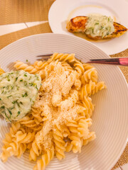 Creamy pasta and herb chicken dinner presentation