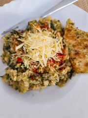 Savory lentil dish with grilled chicken and cheese