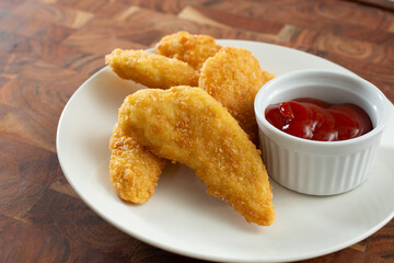 A view of a plate of gluten-free chicken tenders.