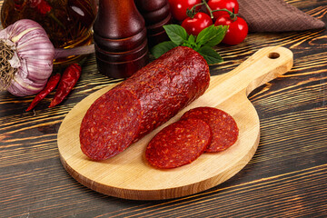 Spicy pepperoni sausages with sliced piece
