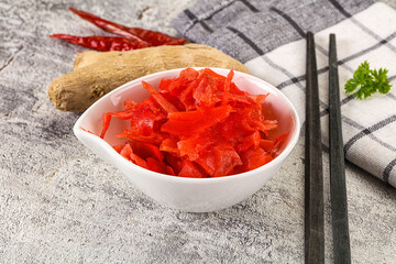 Marinated ginger root in the bowl