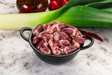 Raw chicken hearts in the bowl