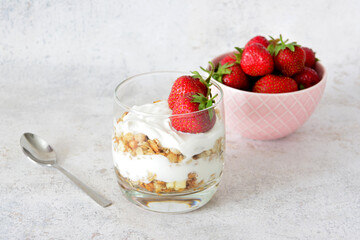 a dessert with Strawberry Yogurt and Granola in the drinking glass