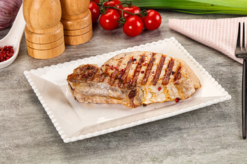 Grilled pork loin steak with bone