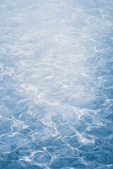 Obraz premium Rippled Water Surface Frozen Mid-Motion with Soft Reflections and Refractions