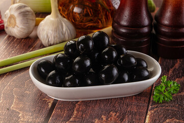 Mediterranean marinated Black olives in the bowl