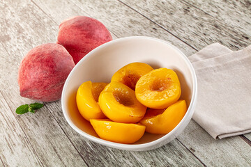 Sweet ripe yellow canned peaches