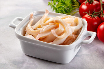 Canned marinated squid rings heap