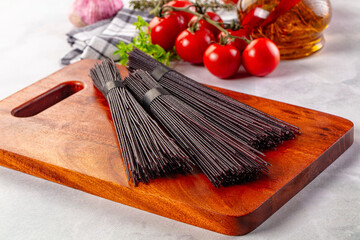 Raw black rice noodles lines