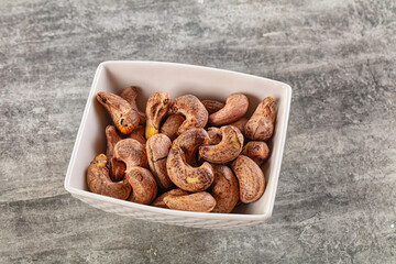 Unpeeled cashew nuts in the bowl