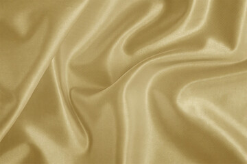 Smooth, elegant golden silk fabric with a flowing, shiny texture creates a luxurious backdrop