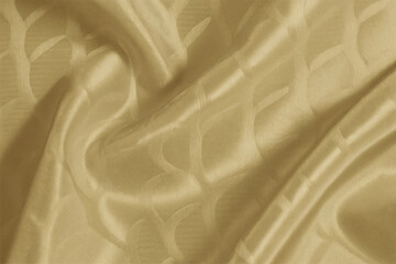 Smooth, elegant golden silk fabric with a flowing, shiny texture creates a luxurious backdrop
