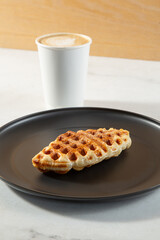 A view of a croffle and latte.