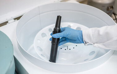 Tube inserted in a laboratory centrifuge. Centrifuge rotor for medical and scientific research.