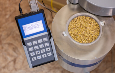 A bowl with grain is installed in a radiometer designed to measure the volumetric VA and specific...