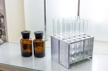 Concept of science and research with laboratory accessories. Laboratory flasks and test tubes on...