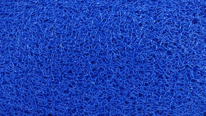 Textured Blue Abstract: An eye-level shot captures the dynamic texture of an endless expanse of blue abstract design. The intricate, woven pattern evokes a sense of depth and complexity.