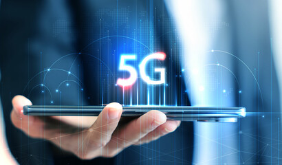 Hand holding smartphone with 5G icon and global network interface, representing high-speed wireless technology, digital connectivity, IoT, and future communication concept. communication network.