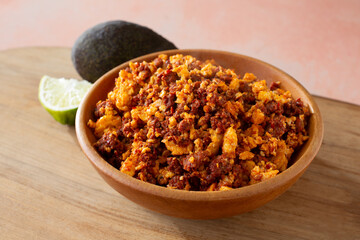 A view of a bowl of chorizo con huevos.