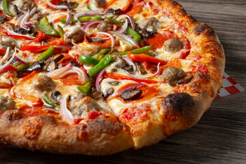 A closeup view of a deluxe pizza.