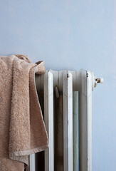 brown towel drying on radiator
