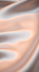 Delicate folds cascade across lustrous satin fabric, creating a smooth texture with subtle variations in color.