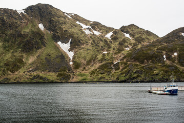 Rocky Fjordside Mountain with Snow