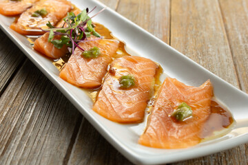A closeup view of salmon carpaccio.