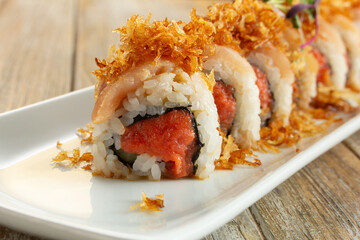 A closeup view of a spicy tuna roll.