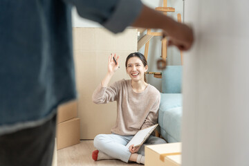 Moving house, relocation. Open the door found wife smile and play on new house, inside the room was...