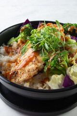 A closeup view of a chicken bowl.