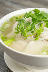 A view of a bowl of chicken pho.