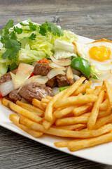 A view of a plate of shaking beef.