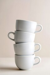  Stacked Set of Four White Ceramic Cups