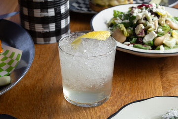 A view of a clear colored cocktail.