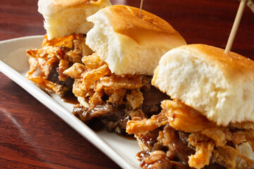 A view of three short rib sliders.