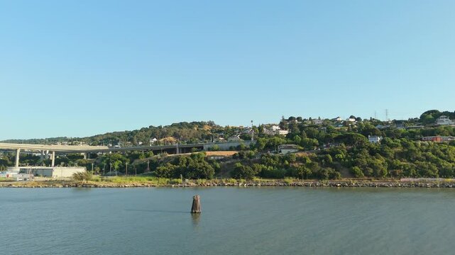 A slow aerial push in of the waterfront in Crocket California.