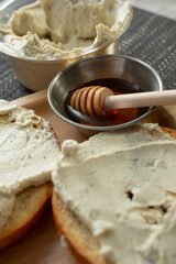 A view of gluten free bagels with diary free cheese spread.