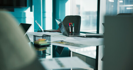 Laptop, desk and documents in empty office for meeting, discussion or boardroom for planning....