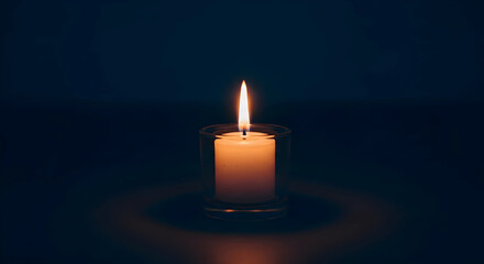 Burning candle in the dark background
