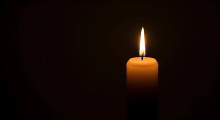 Burning candle in the dark background