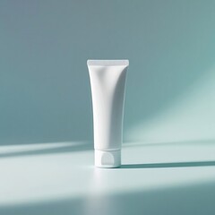 A white cosmetic tube, tilted slightly to the side, casting a soft shadow, on a light blue gradient background, studio setup for beauty branding, minimal and clean.