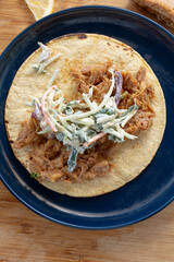 A top down view of a pulled chicken taco.