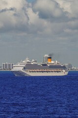 Modern cruiseships cruise ship liners Magica, Seaside, Armonia and Fortuna anchored offshore of...